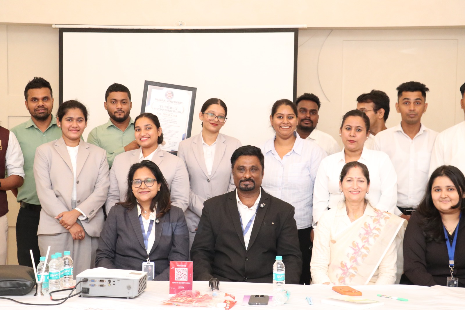 Corporate team celebrating with Paramount World Records Certificate of World Record Creation