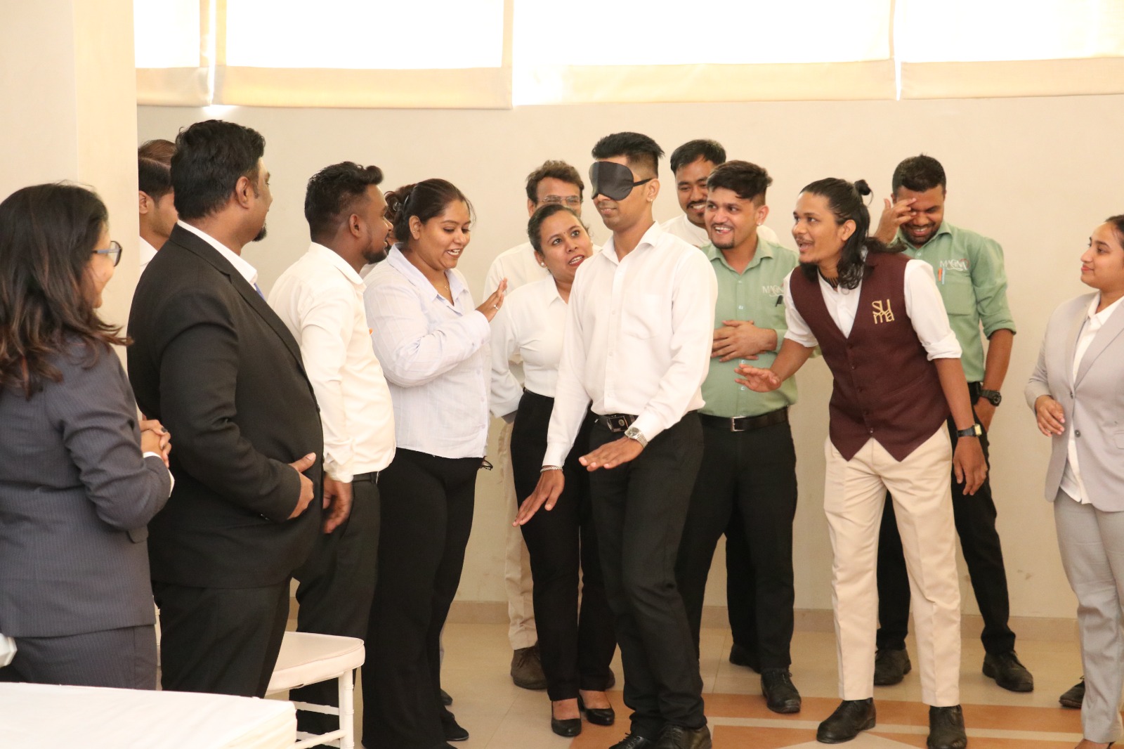 Blindfold trust-building team activity during experiential learning workshop