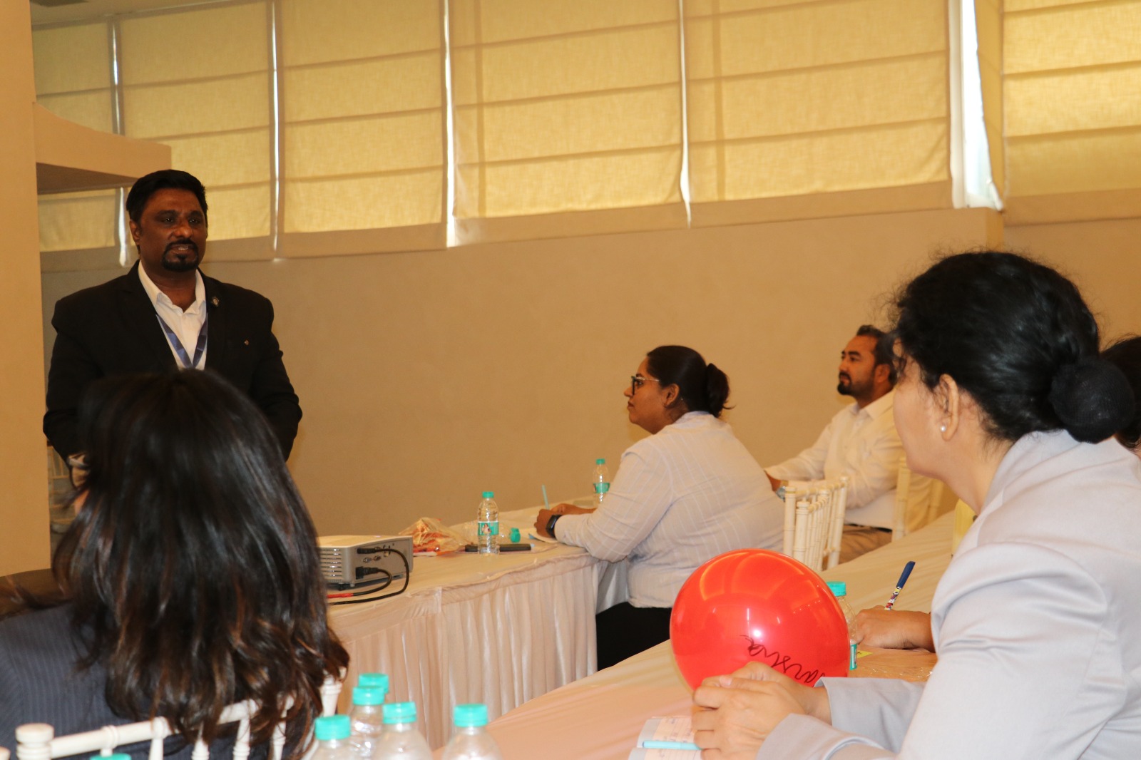 Leadership intervention workshop with trainer addressing engaged participants
