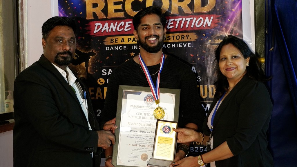 World record holder with certificate and trophy at Dreamers Dance Studio