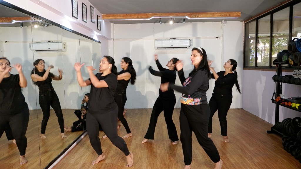 Young girl receiving world record certificate at Dreamers Dance Studio event