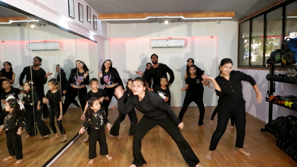 Young girl with world record certificate and medal at Dreamers Dance Studio