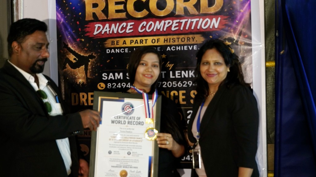 Young girl with medal and certificate at Dreamers Dance Studio event