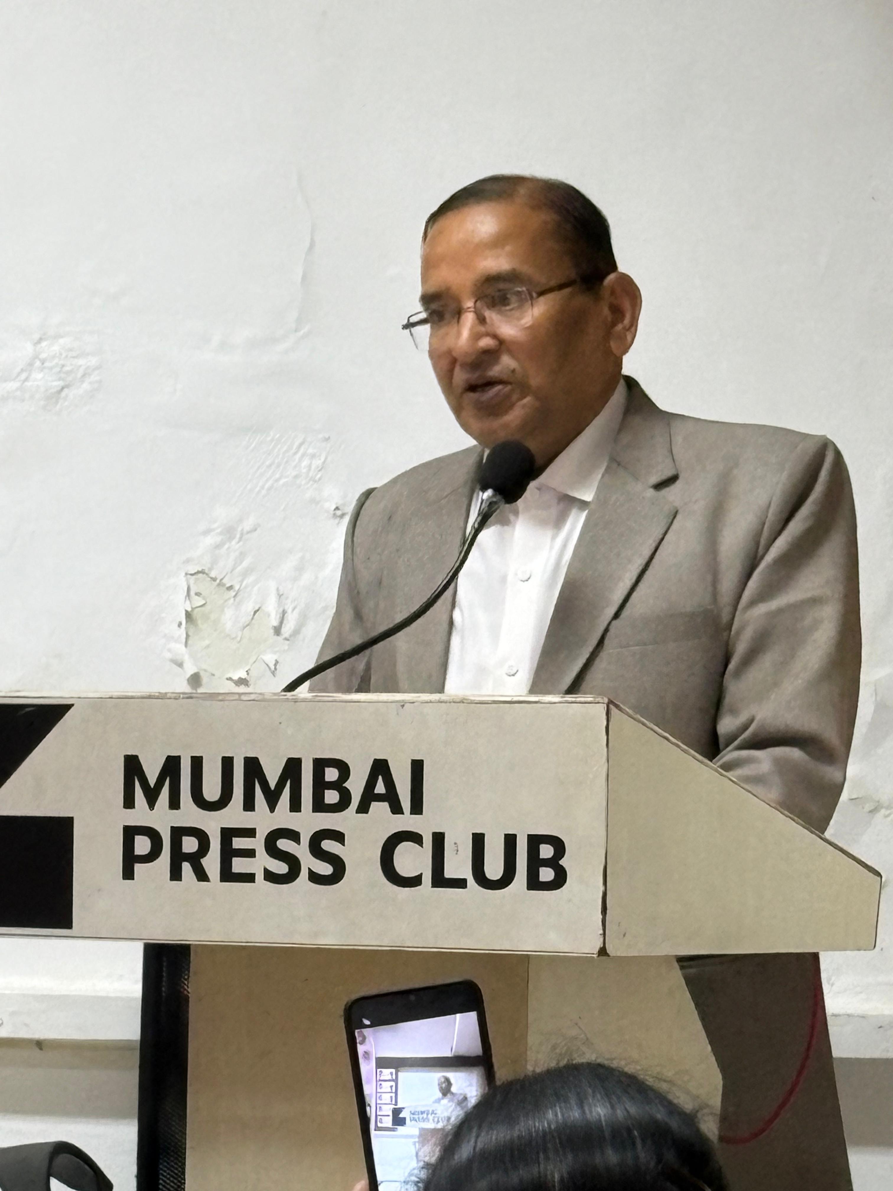Chief guest speaking at the podium, Mumbai Press Club