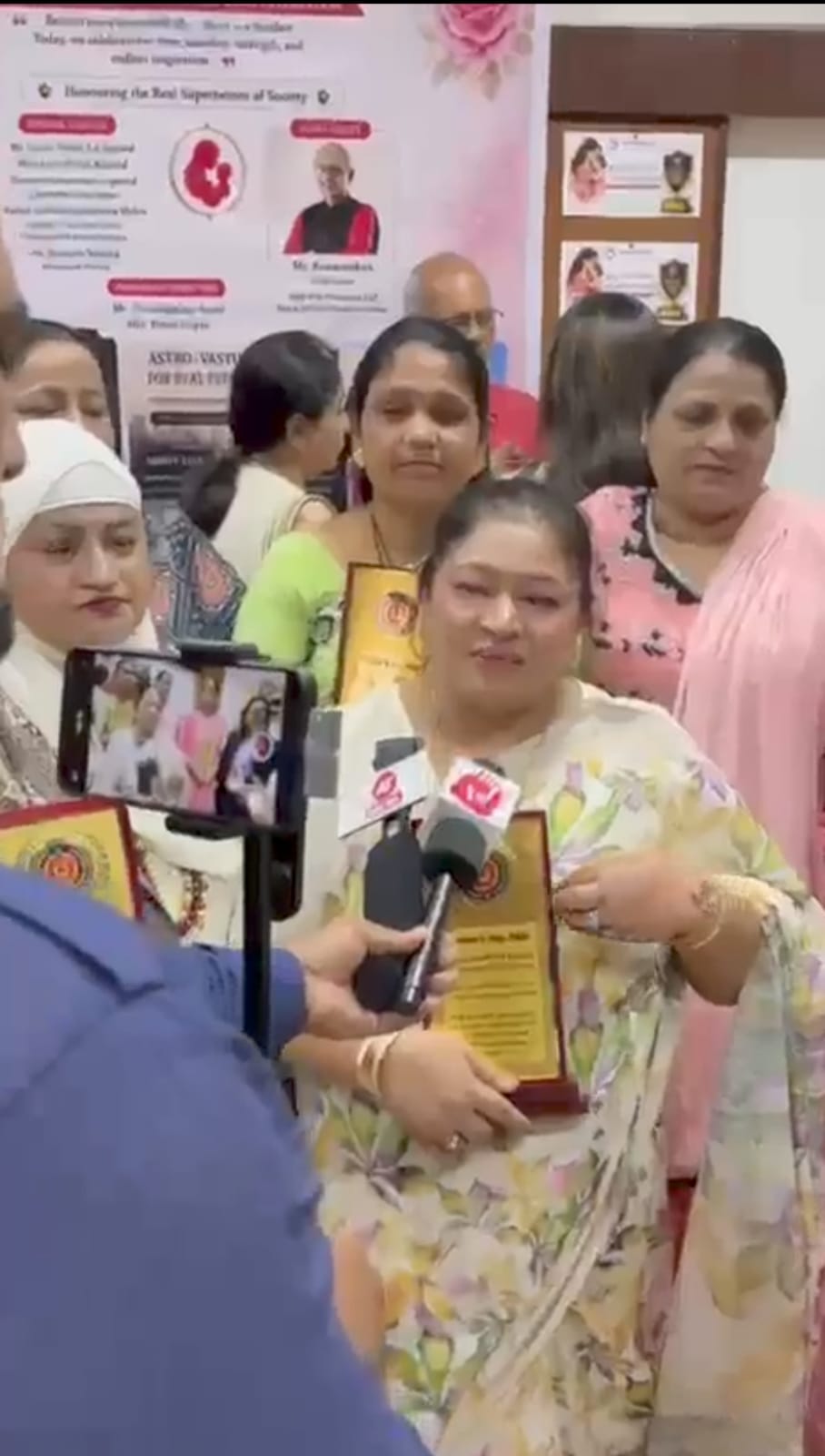 Media interview with an award recipient at the Mother's Day ceremony